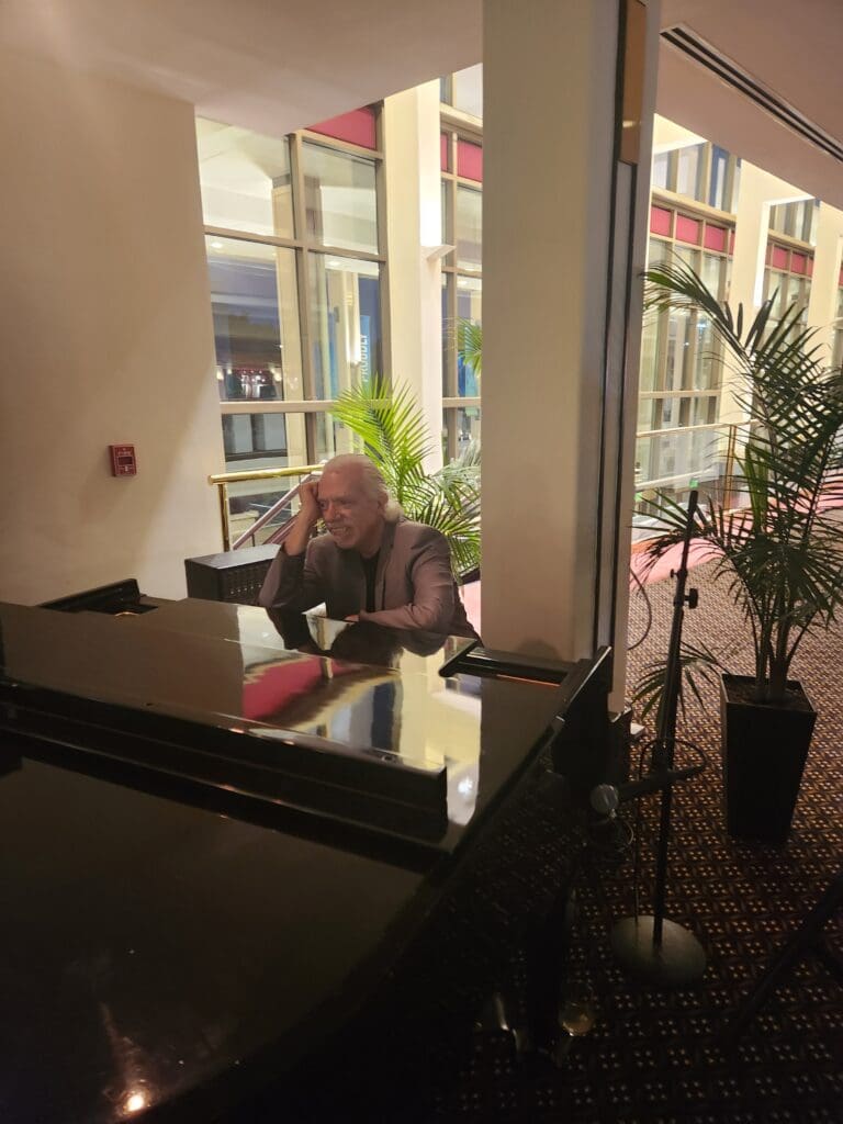 Tony Castellano Jr pining at his piano